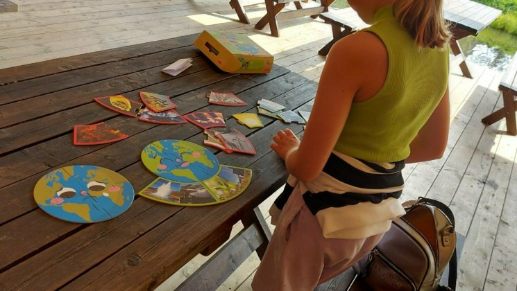 Child playing a game at a table